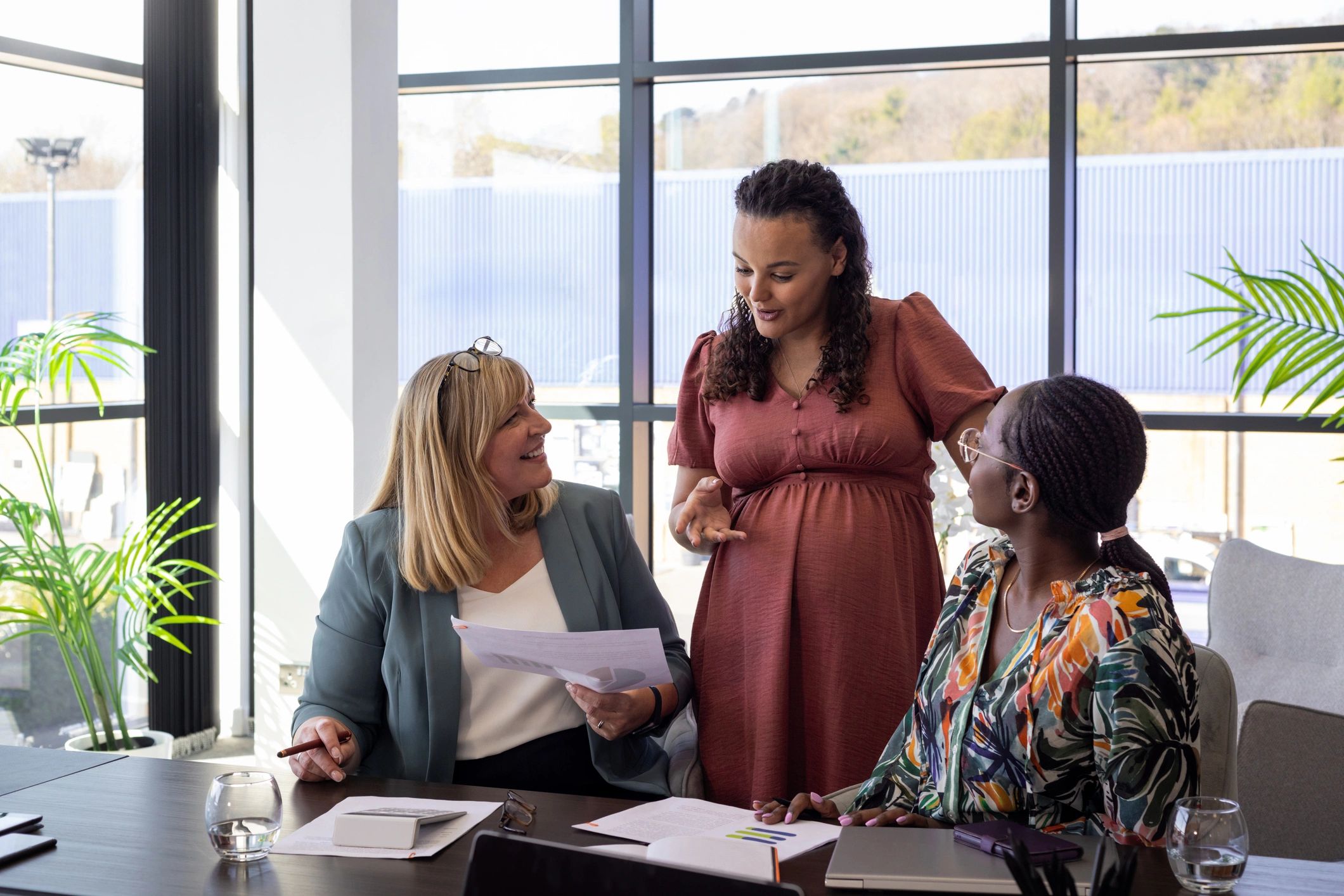 Consulting team reviewing plans and discussing business software strategy