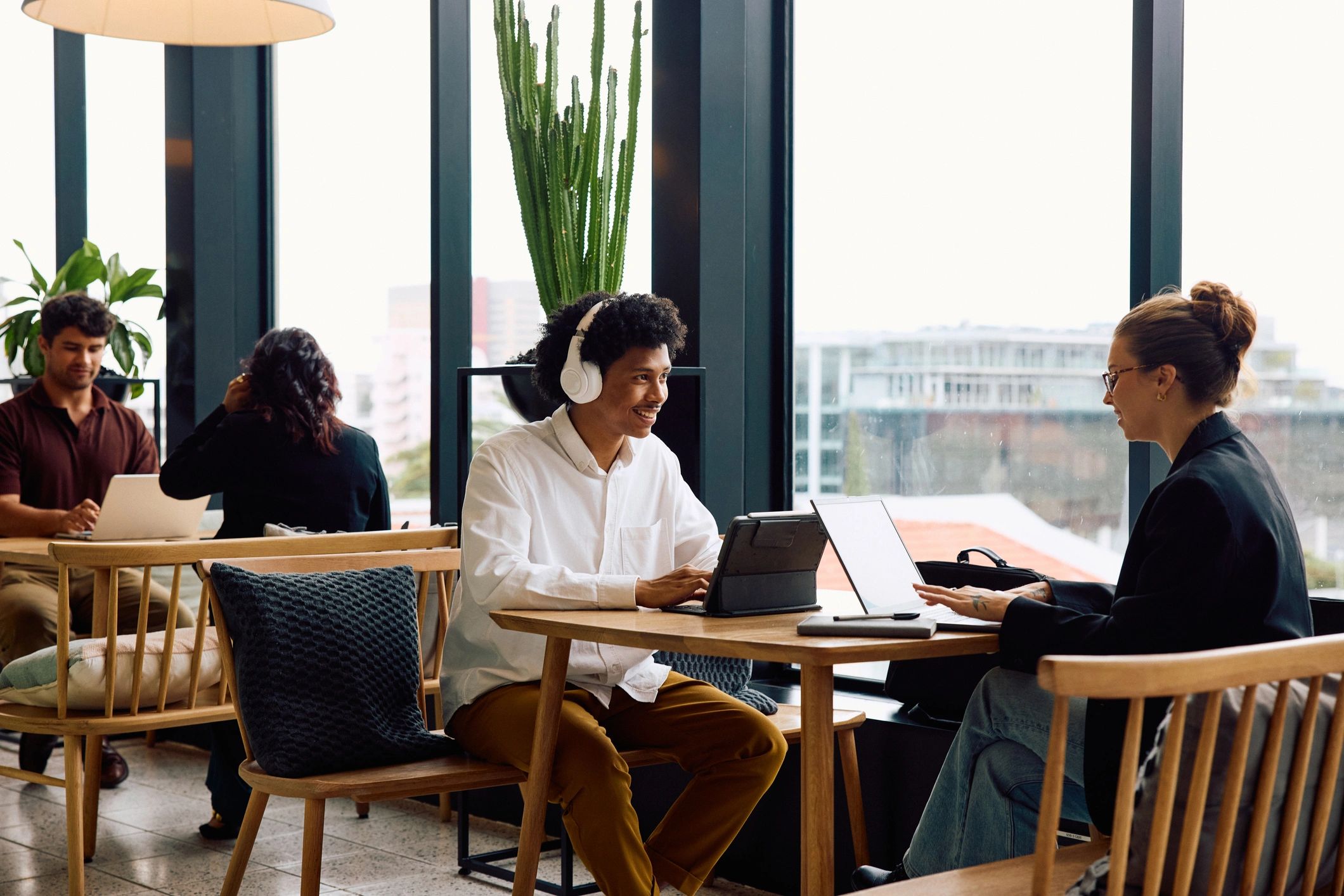 Small business team reviewing software options on laptops
